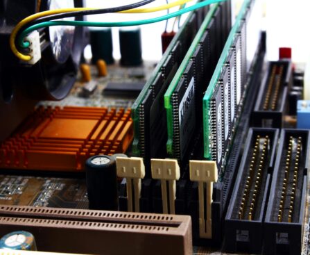 Detailed view of computer motherboard featuring RAM, chipset, and wiring.