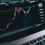 Close-up of a computer screen displaying cryptocurrency market trends and data.