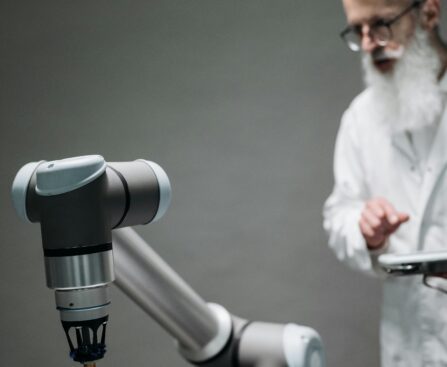 A scientist supervises robotic surgical equipment during an operation, highlighting technological advancement.
